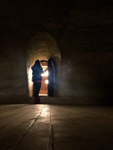 silhouette of woman opening up a door